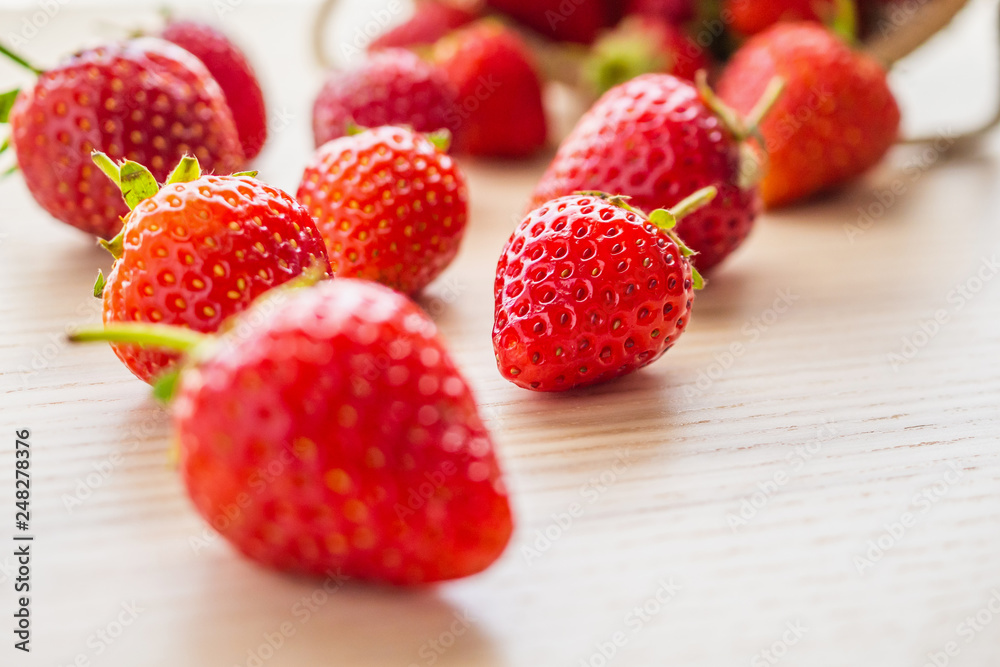Fresh organic red ripe Strawberry fruit on wood background closeup