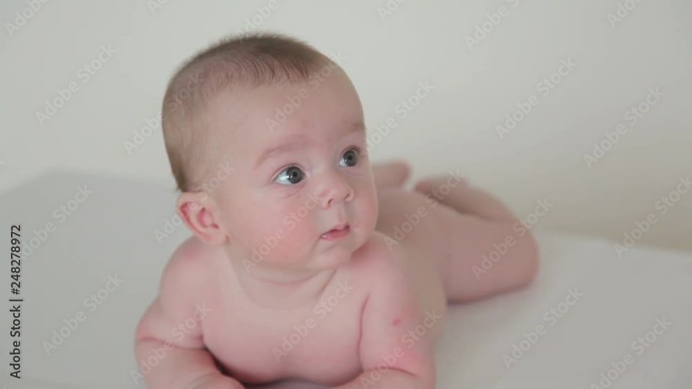 Funny beautiful child looks away in surprise Funny beautiful child looks away in surprise