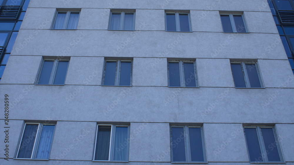 Gray modern building facade with new pvc windows Gray modern building facade with new pvc windows