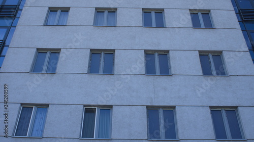 Gray modern building facade with new pvc windows