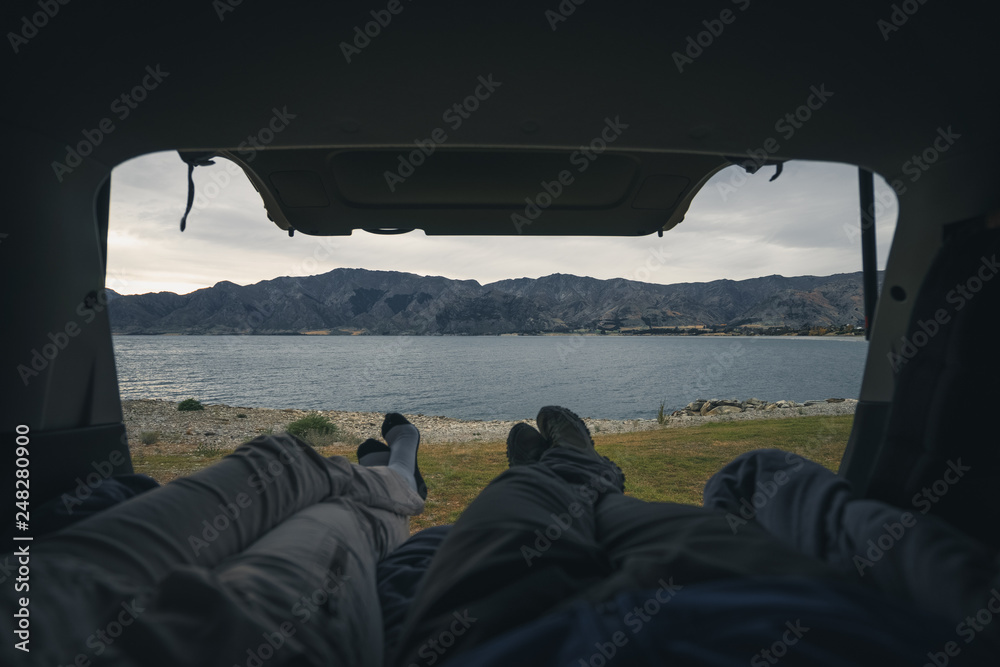 Chilling in a camper van in front of a lake view