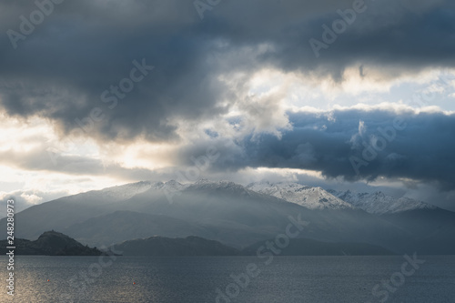 Clouds over snowy mountain and lake © Wilsonkjc