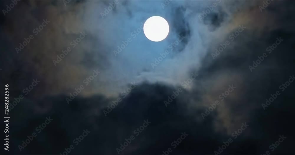 Full moon with fast mooving clouds timelapse at night. 4k 60fps Ultra HD video.