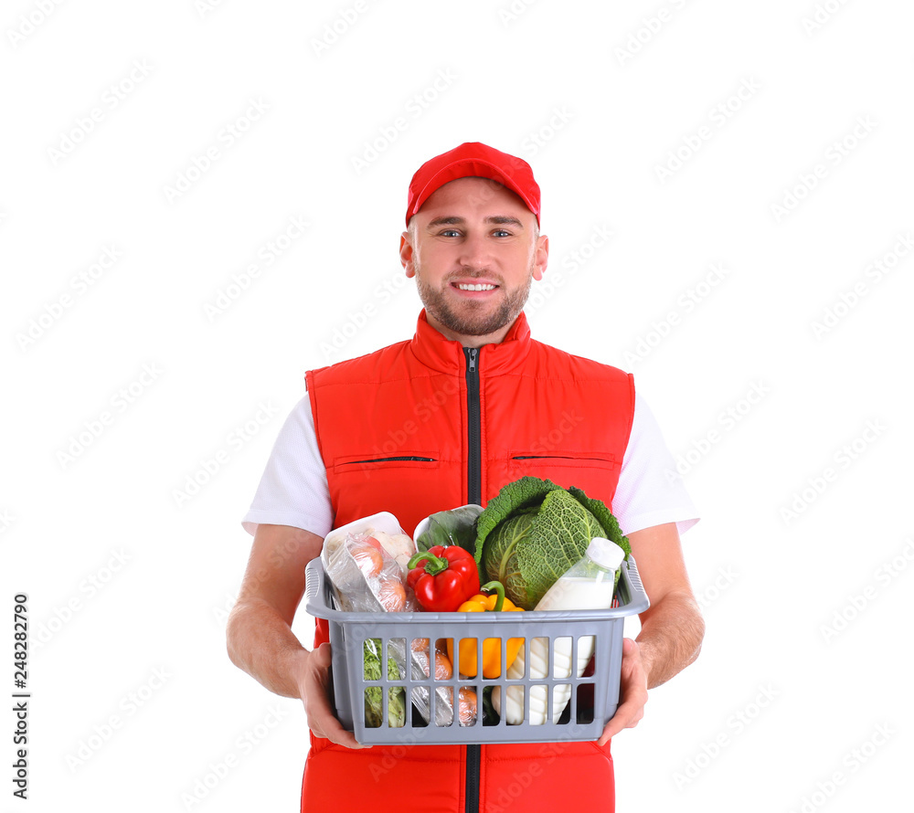 Delivery man holding plastic crate with food products on white background Delivery man holding plastic crate with food products on white background