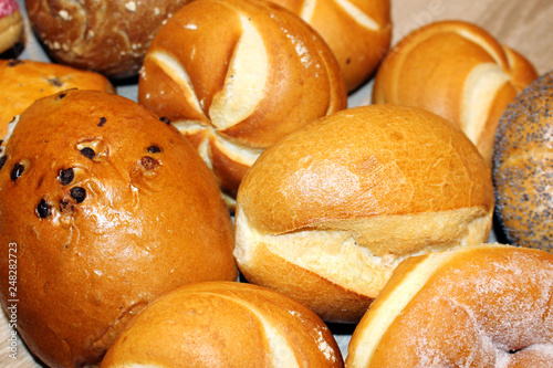 tradition german bakery products in a basket: buns, bread, bread rolls, donut sweet pretzel