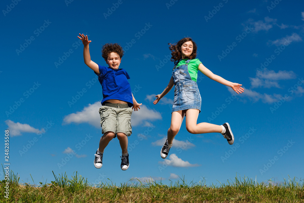 Girl and boy running, jumping outdoor Girl and boy running, jumping outdoor