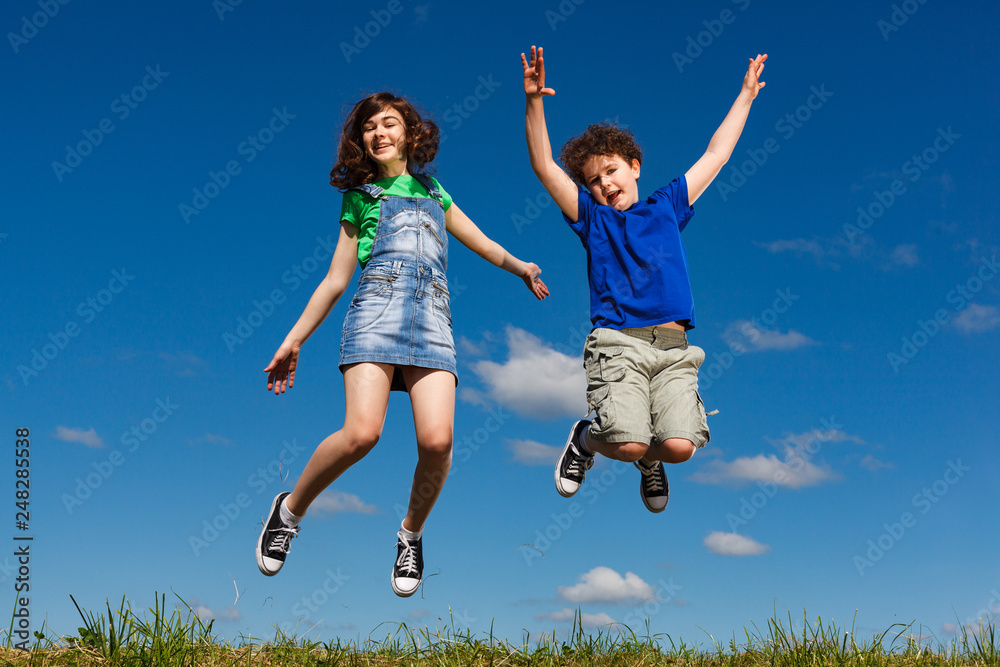Girl and boy running, jumping outdoor Girl and boy running, jumping outdoor
