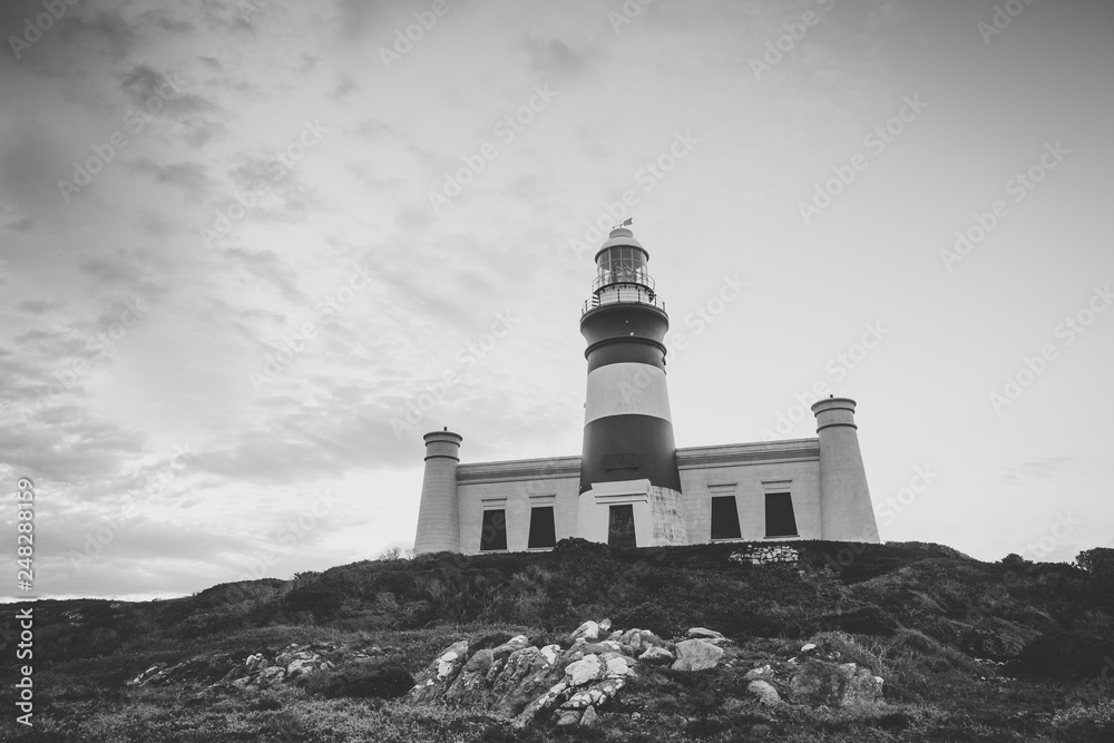 Wide angle image of the iconic lighthouse in cape agulhas at the southern most tip of africa
