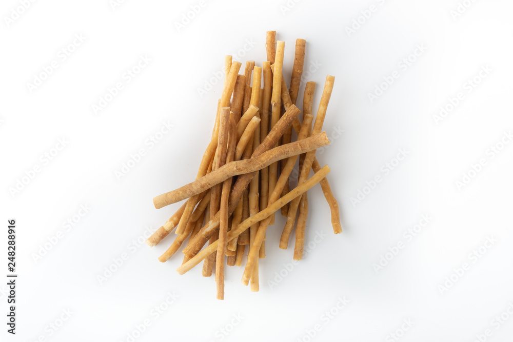 Natural toothbrush Miswak (Kayu Sugi) on white background with selective focus. It is a teeth cleaning twig made from the Salvadora persica tree and also know as miswaak, siwak, Sugi or sewak Natural toothbrush Miswak (Kayu Sugi) on white background with selective focus. It is a teeth cleaning twig made from the Salvadora persica tree and also know as miswaak, siwak, Sugi or sewak
