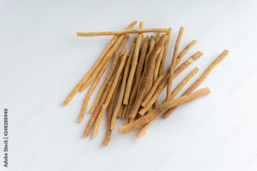 Natural toothbrush Miswak (Kayu Sugi) on white background with selective focus. It is a teeth cleaning twig made from the Salvadora persica tree and also know as miswaak, siwak, Sugi or sewak Natural toothbrush Miswak (Kayu Sugi) on white background with selective focus. It is a teeth cleaning twig made from the Salvadora persica tree and also know as miswaak, siwak, Sugi or sewak