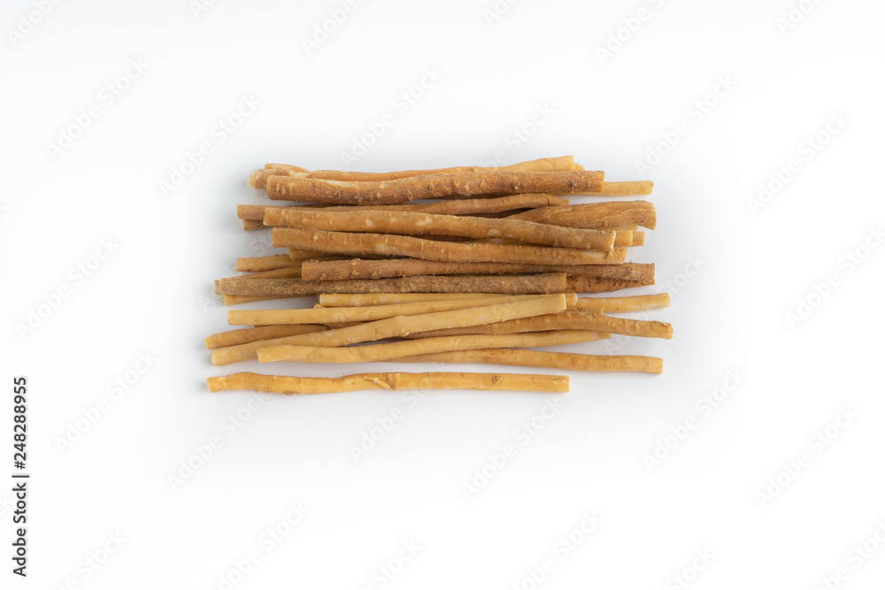 Natural toothbrush Miswak (Kayu Sugi) on white background with selective focus. It is a teeth cleaning twig made from the Salvadora persica tree and also know as miswaak, siwak, Sugi or sewak