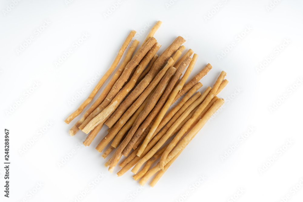 Natural toothbrush Miswak (Kayu Sugi) on white background with selective focus. It is a teeth cleaning twig made from the Salvadora persica tree and also know as miswaak, siwak, Sugi or sewak Natural toothbrush Miswak (Kayu Sugi) on white background with selective focus. It is a teeth cleaning twig made from the Salvadora persica tree and also know as miswaak, siwak, Sugi or sewak