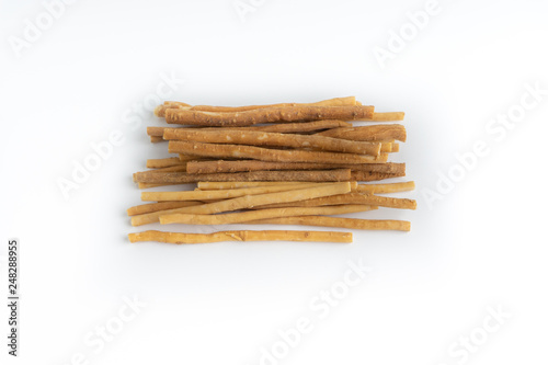 Natural toothbrush Miswak (Kayu Sugi) on white background with selective focus. It is a teeth cleaning twig made from the Salvadora persica tree and also know as miswaak, siwak, Sugi or sewak