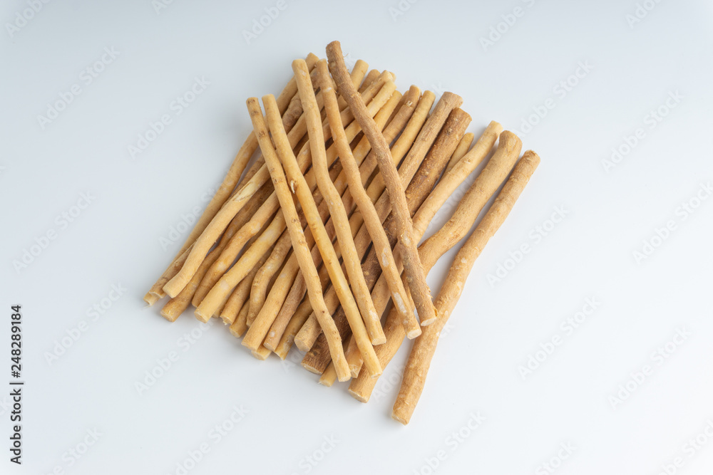 Natural toothbrush Miswak (Kayu Sugi) on white background with selective focus. It is a teeth cleaning twig made from the Salvadora persica tree and also know as miswaak, siwak, Sugi or sewak Natural toothbrush Miswak (Kayu Sugi) on white background with selective focus. It is a teeth cleaning twig made from the Salvadora persica tree and also know as miswaak, siwak, Sugi or sewak