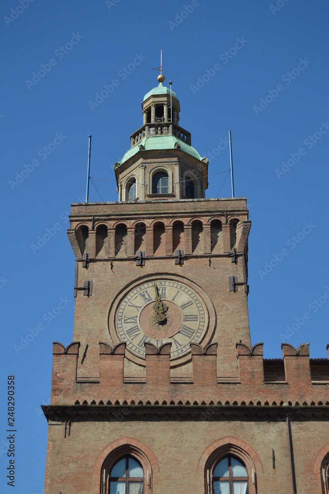 Clock In The Main Facade Of The Communal Palace In Piazza Maggiore In Bologna. Bologna Travel, holidays, architecture. March 31, 2015. Bologna, Emilia Romagna, Italy.