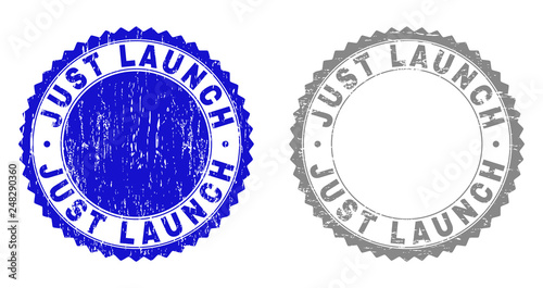 Grunge JUST LAUNCH stamp seals isolated on a white background. Rosette seals with distress texture in blue and grey colors. Vector rubber stamp imprint of JUST LAUNCH tag inside round rosette.