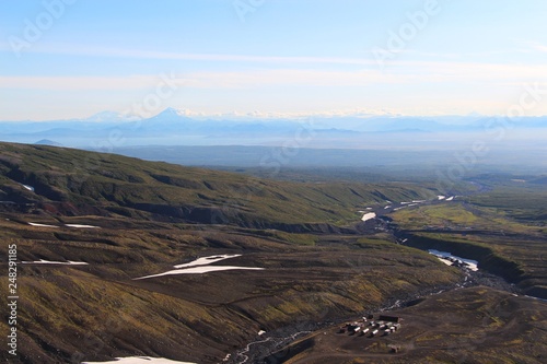 View of valley at the foot of Avachinsky and Koryaksky volcanoes. Gorely and Mutnovsky volcanoes are visible in the background. photo