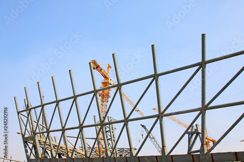 Steel frame and tower crane in the construction site