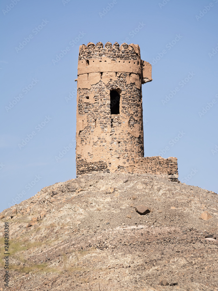Ancient tower on top of a rocky hill in Oman
