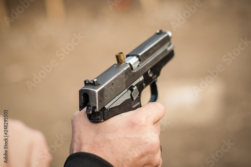 Quadro em tela Close-up detail view of pistol, handgun, gun malfunctions