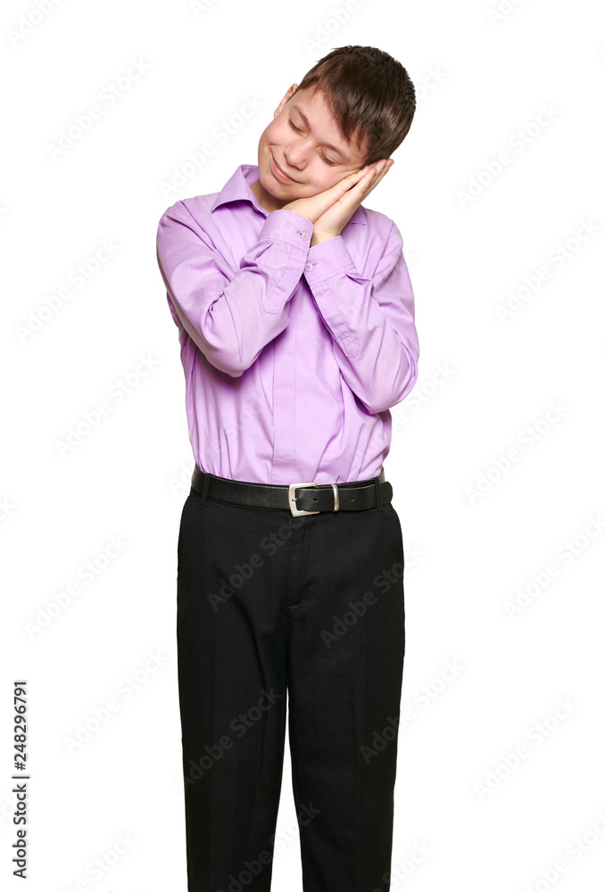 Boy posing on white background, black trousers and purple shirt Boy posing on white background, black trousers and purple shirt