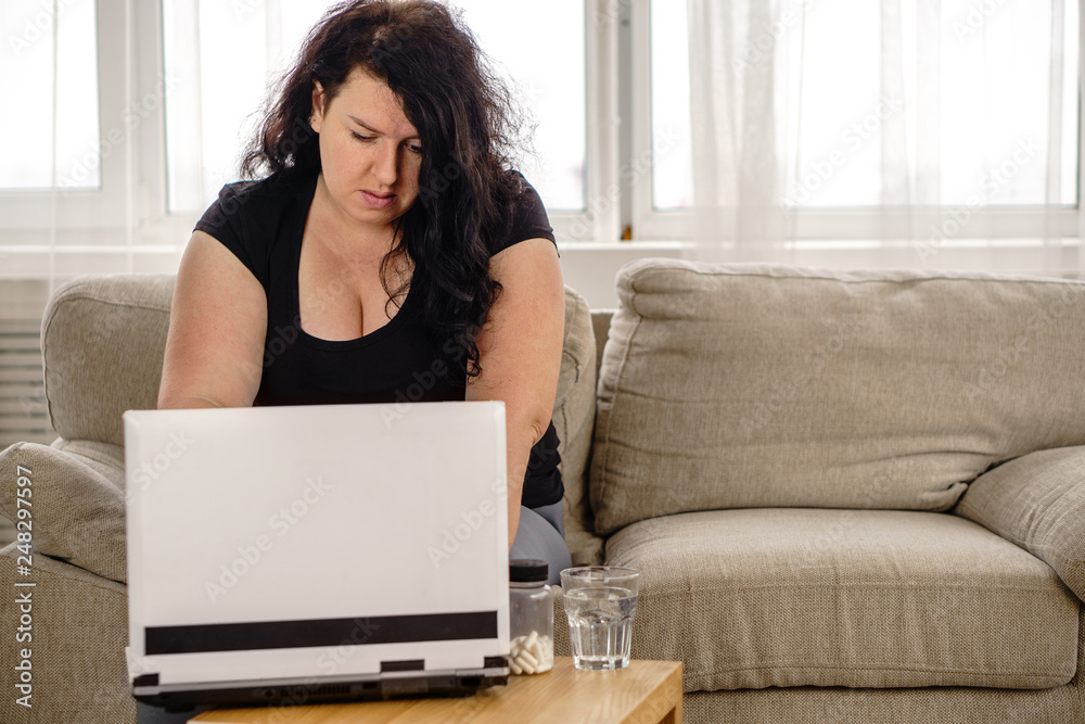 weight loss medical therapy, online therapist support, hypertension, diabetes prevention concept. overweight fat woman reading prescription before taking pills weight loss medical therapy, online therapist support, hypertension, diabetes prevention concept. overweight fat woman reading prescription before taking pills