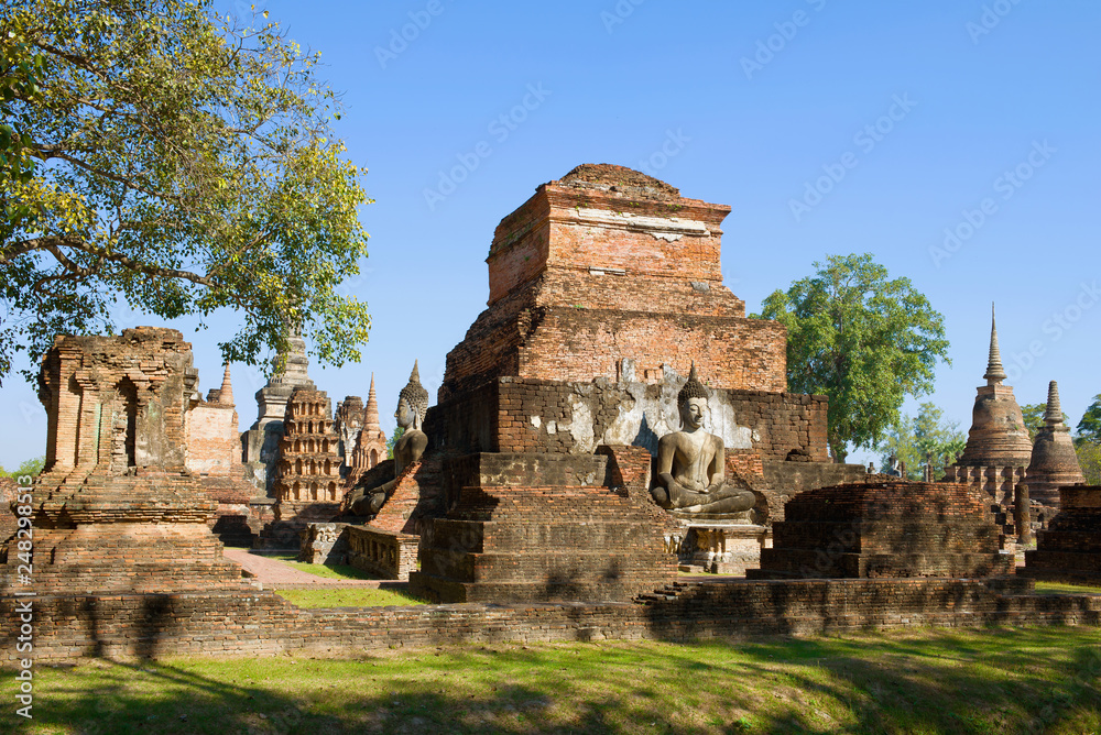 On the ruins of an ancient Buddhist temple Wat Mahathat. Historical Park of Sukhothai, Thailand