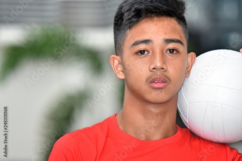 Serious Male Athlete With Volleyball photo