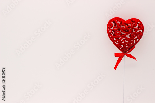 The Valentine Day Concept. Red heart on the white background. Copy space area.