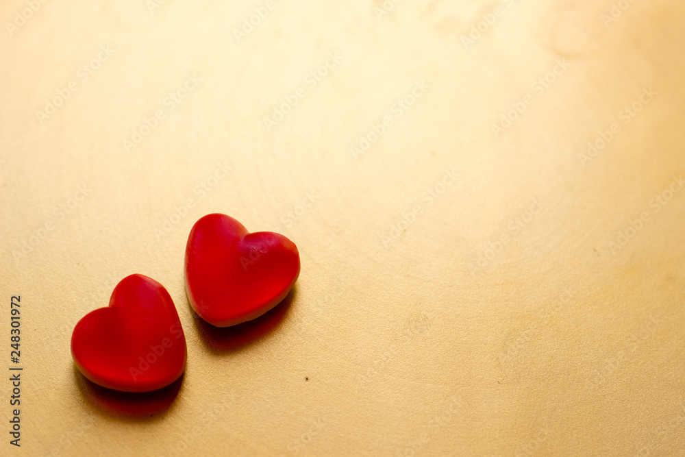 Fototapeta premium Jelly hearts on the golden metal background. Valentine Day Concept.