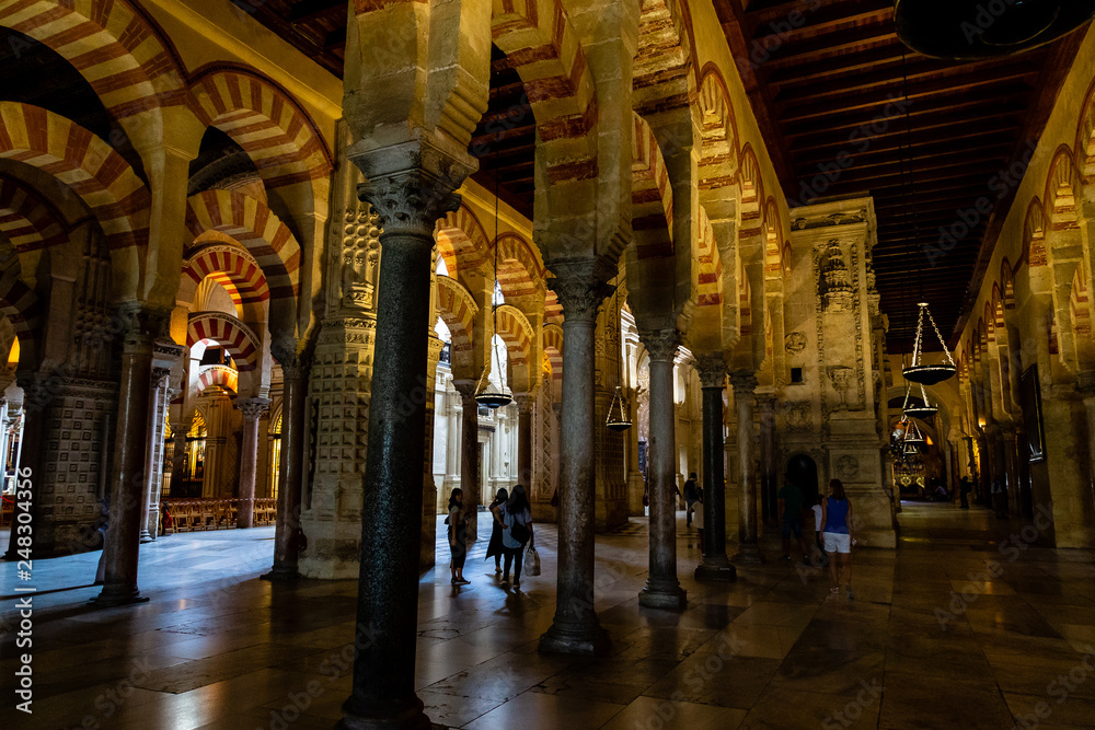 Oct 2018 - Cordoba, Spain - The famous arched interiors of Mezquita, Catedral de Cordoba, a former Moorish Mosque that is now the Cathedral of Cordoba. Mezquita is a UNESCO World Heritage Site.