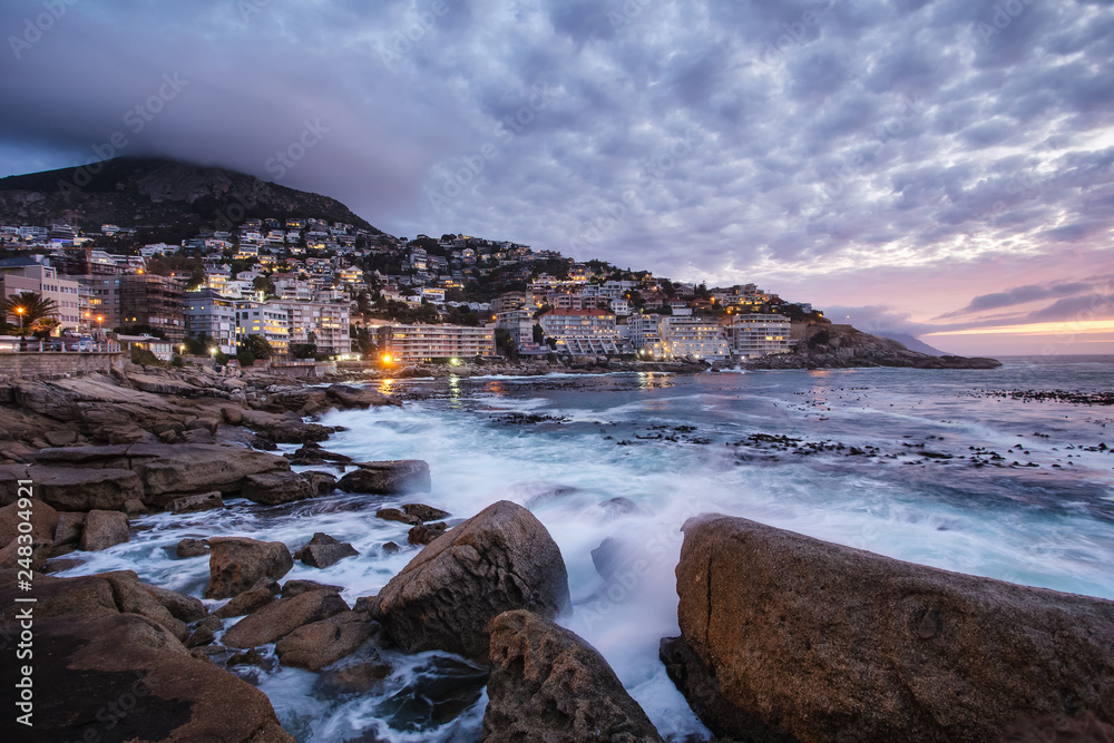 Naklejka premium Wide angle view of a seascape scene in Seapoint in Cape town south africa