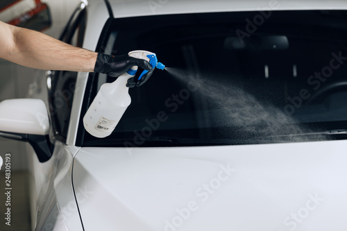 man with black gloves holding a botttle with spray, popular car wash sprayer, suppliers