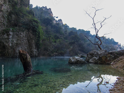 Provence France, Fontaine de Vaucluse: Mysterious landscape with a spring in a valley at the foot of the Vaucluse Mountains photo