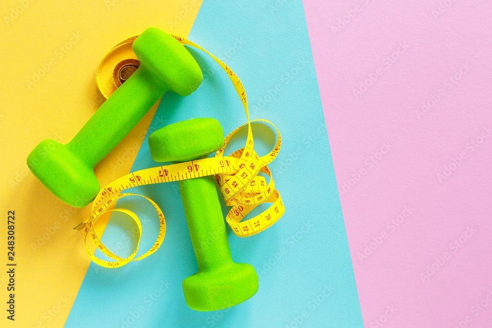 dumbbells on wooden background