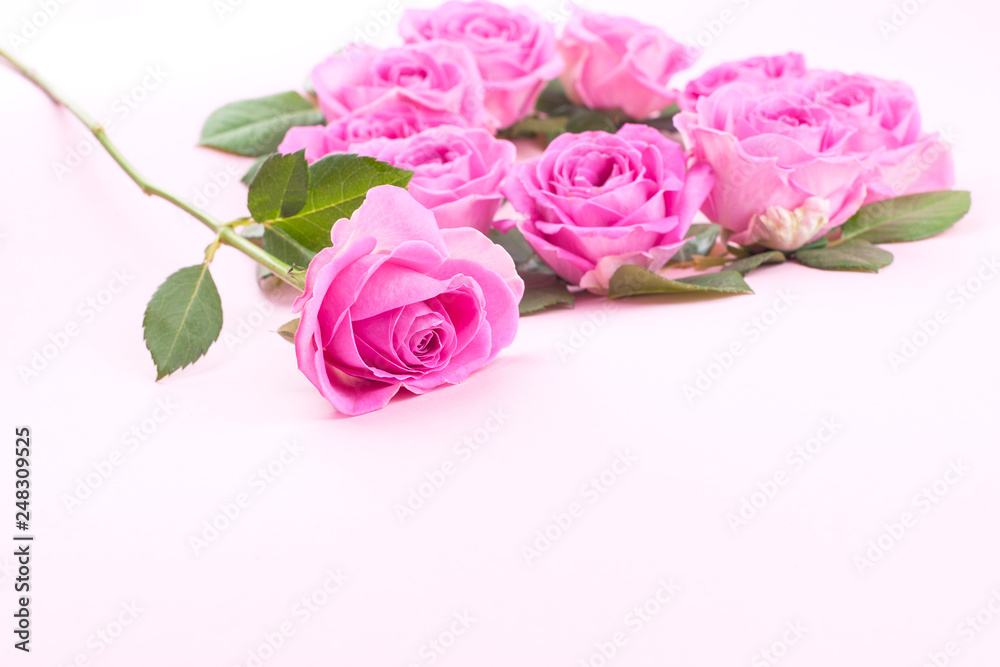 roses and envelope on a light background. Bouquet and letter as a gift in the concept of Valentine's Day and Women's Day. Free space for text.