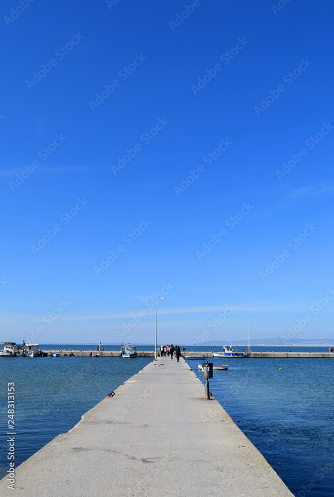 Pier of Neoi Epivates, suburb of Thessaloniki, Greece. Blue sea landscape. 