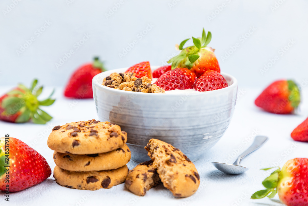 cream dessert with fruit in a bowl on blue background