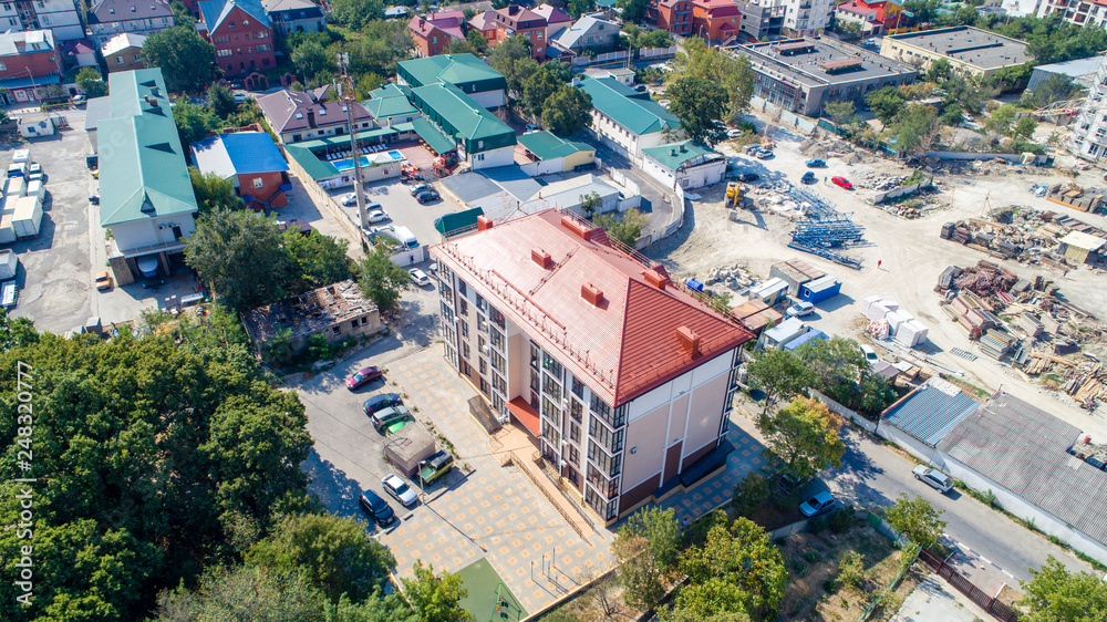 New multi-storey residential building on the shore of the beautiful Gelendzhik Bay. Black sea coast of the Caucasus, resorts of Kuban. Another residential complex is being built nearby. In the backgro