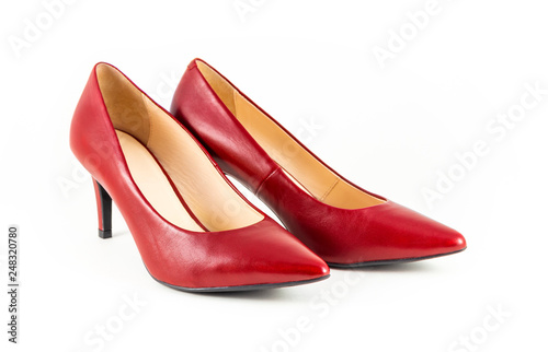 Elegant women's shoes made of red leather on a white background