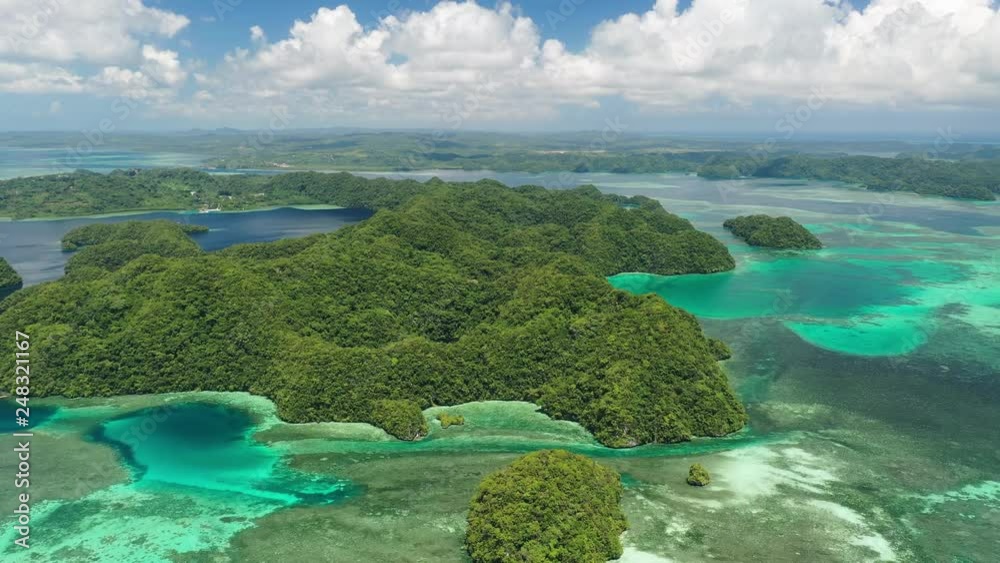 Aerial view of Koror island, many lush green islets and blue lagoons, azure crystal clear waters of western Pacific Ocean - landscape panorama of Micronesia from above, Palau Aerial view of Koror island, many lush green islets and blue lagoons, azure crystal clear waters of western Pacific Ocean - landscape panorama of Micronesia from above, Palau