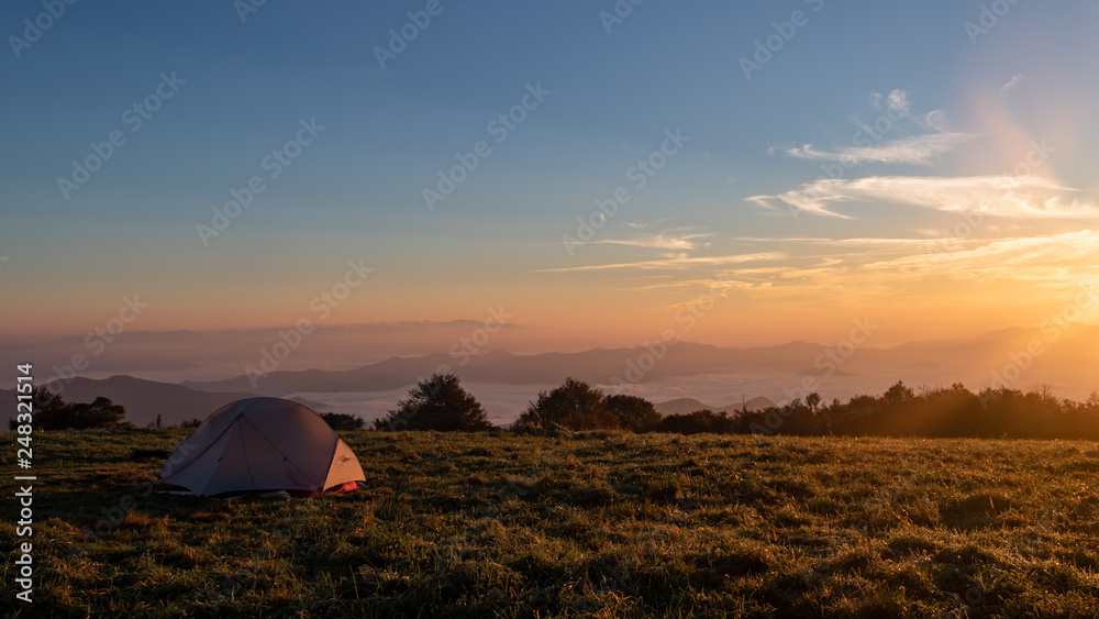 Tent campsite at sunrise on Huckleberry knob in North Carolina