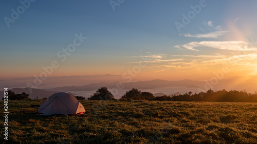 Tent campsite at sunrise on Huckleberry knob in North Carolina