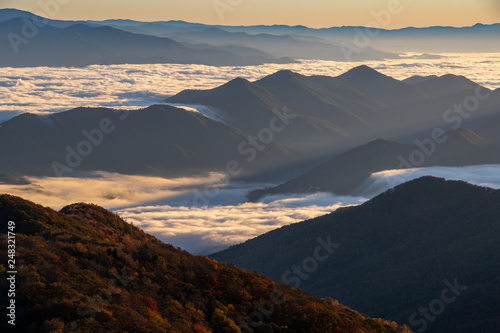 Foggy morning sunrise over unicoi mountains in North Carolina photo