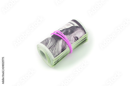 Hundred-dollar bills rolled into a roll isolated on white background
