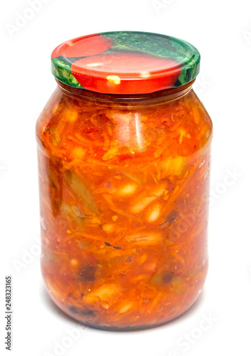 vegetable lecho in a glass jar on a white background