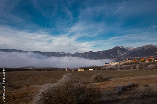 Mountains and Hills panoramic view of the landscape. villages and approaching fog.