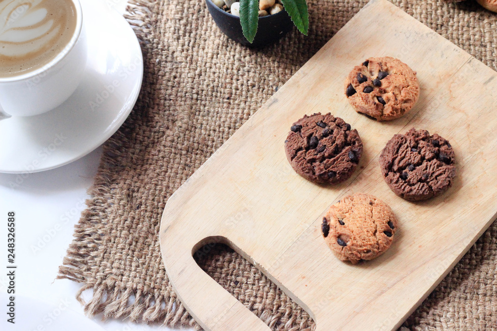 Coffee and Chocolate chip cookies bakery on Butcher Wood and Sack white background