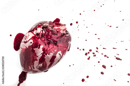 raw pig heart close-up isolated on white background