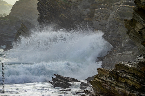 Sea waves breaking in the coast cliffs in Barrika